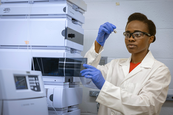 Graduate student working in a lab