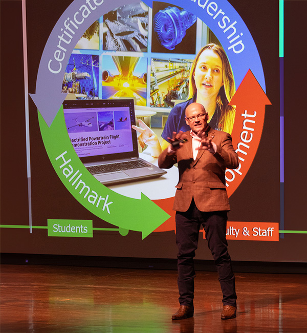 President Greg Crawford on stage delivering the Spring University Update