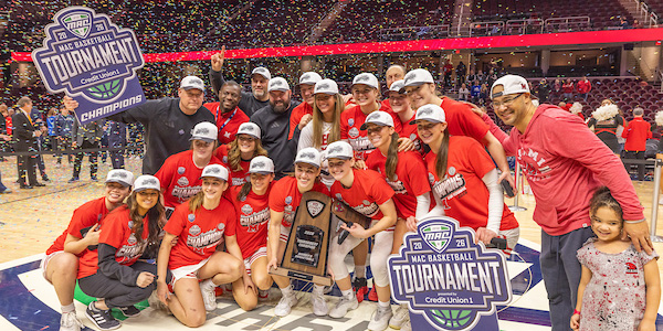Miami University 2026 women's basketball team celebrates winning the MAC championship with a huge trophy and confetti falls from the ceiling.