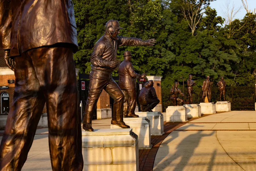 statues of the cradle of coaches at yeager stadium