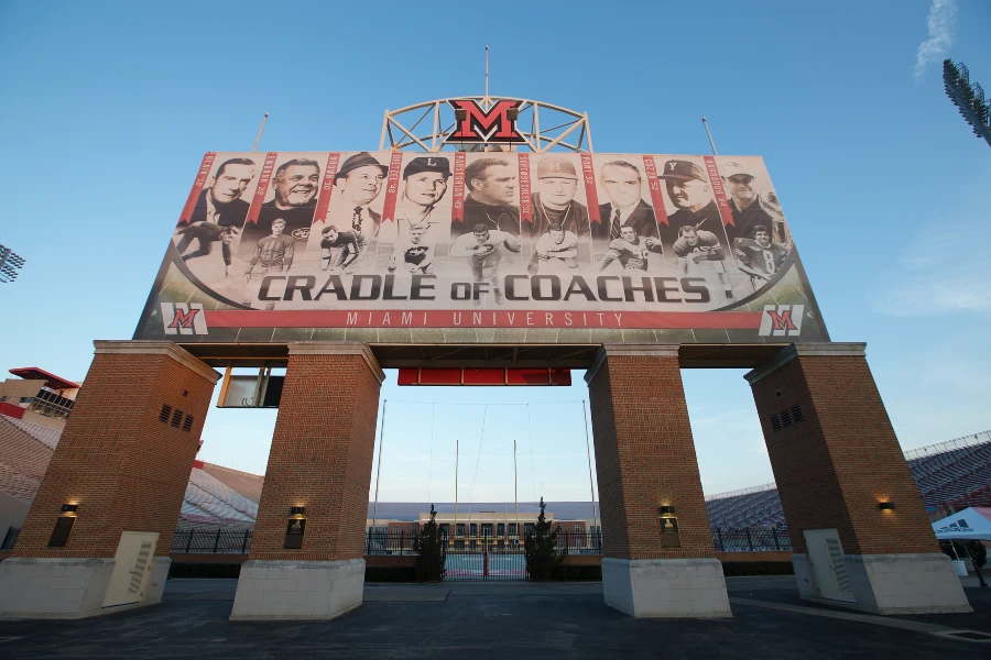A large sign outside of Yeager Stadium that says Cradle of Coaches