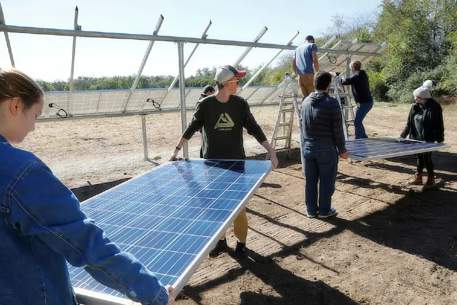 students installing energy panels