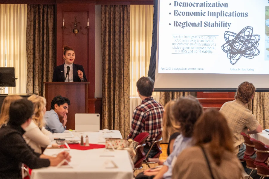 person presenting to a room of people