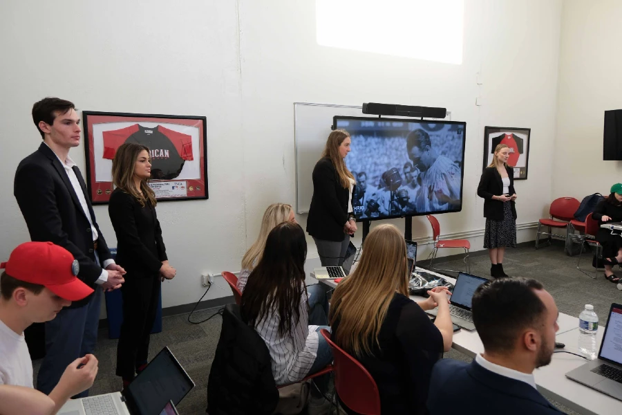 students doing a business presentation in class