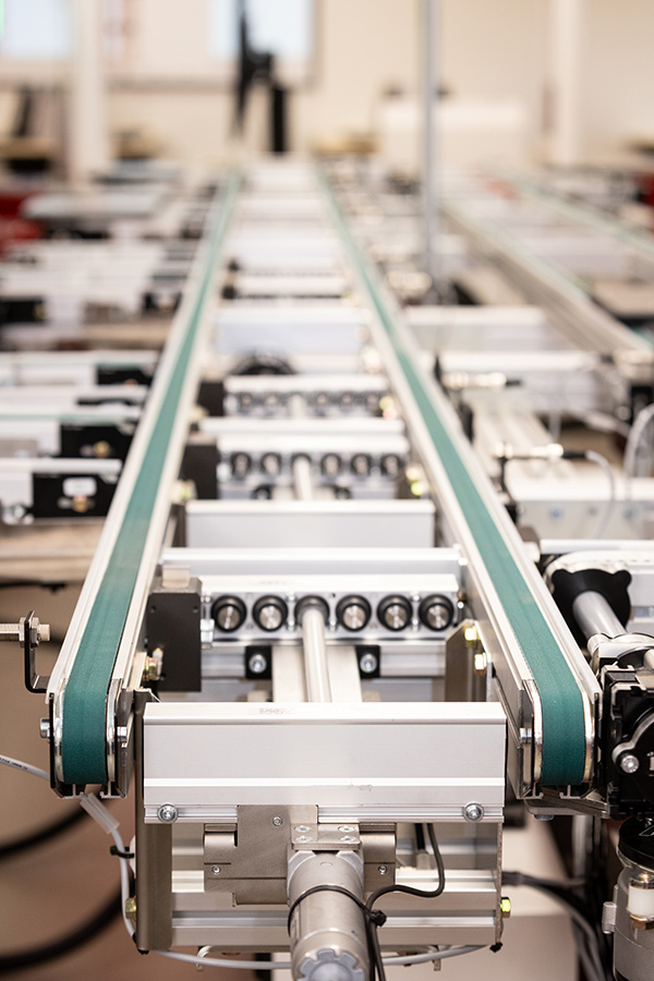 A machine with a long conveyor in the smart fit lab