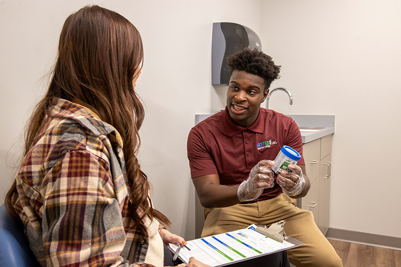 Two people discussing labs