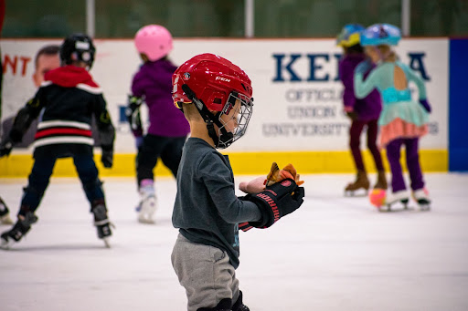 Children skating on an ice rink