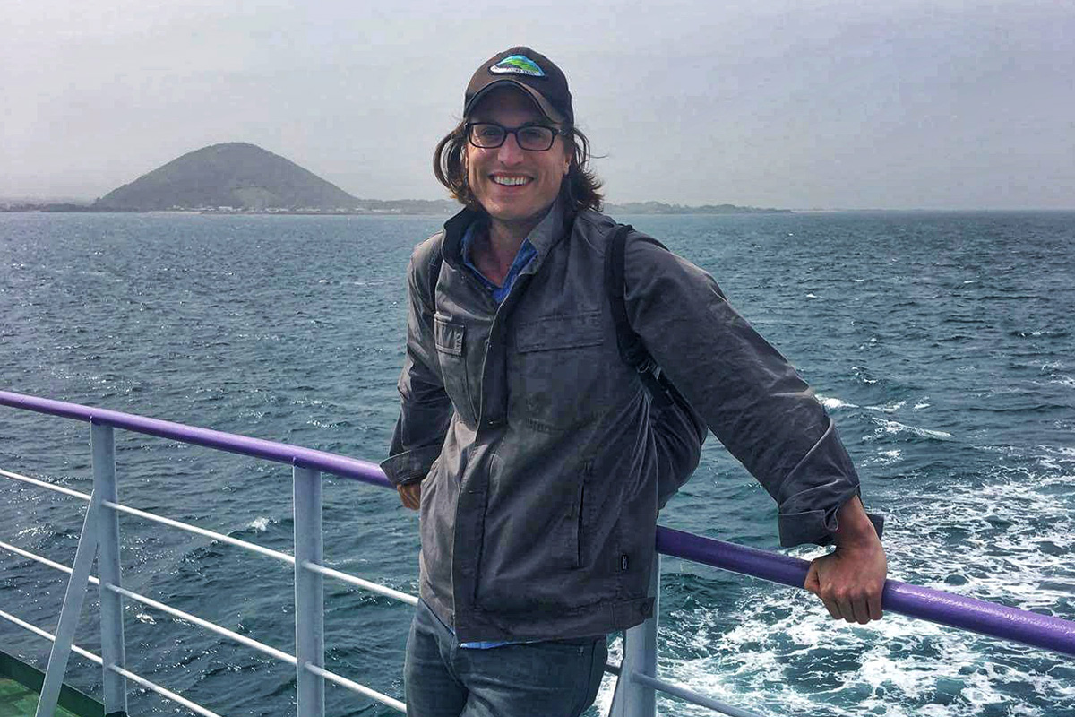 john burgman on a boat in the ocean 