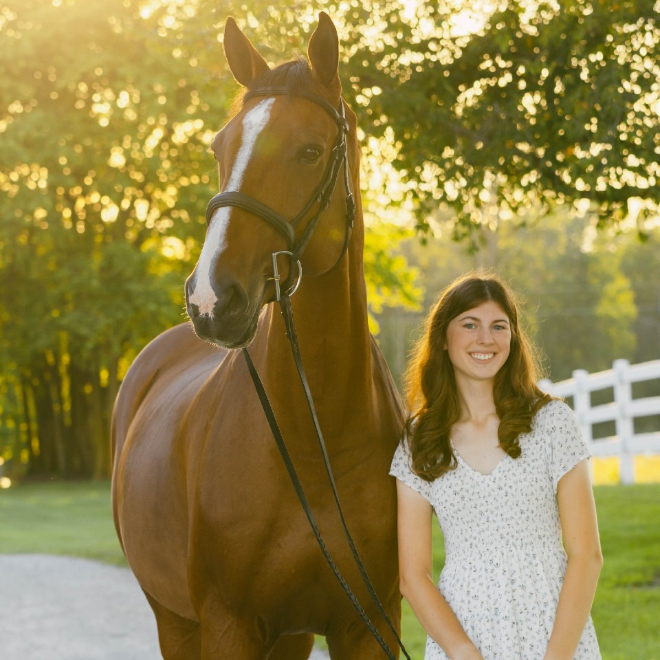 Ava Matas posed with her horse outside