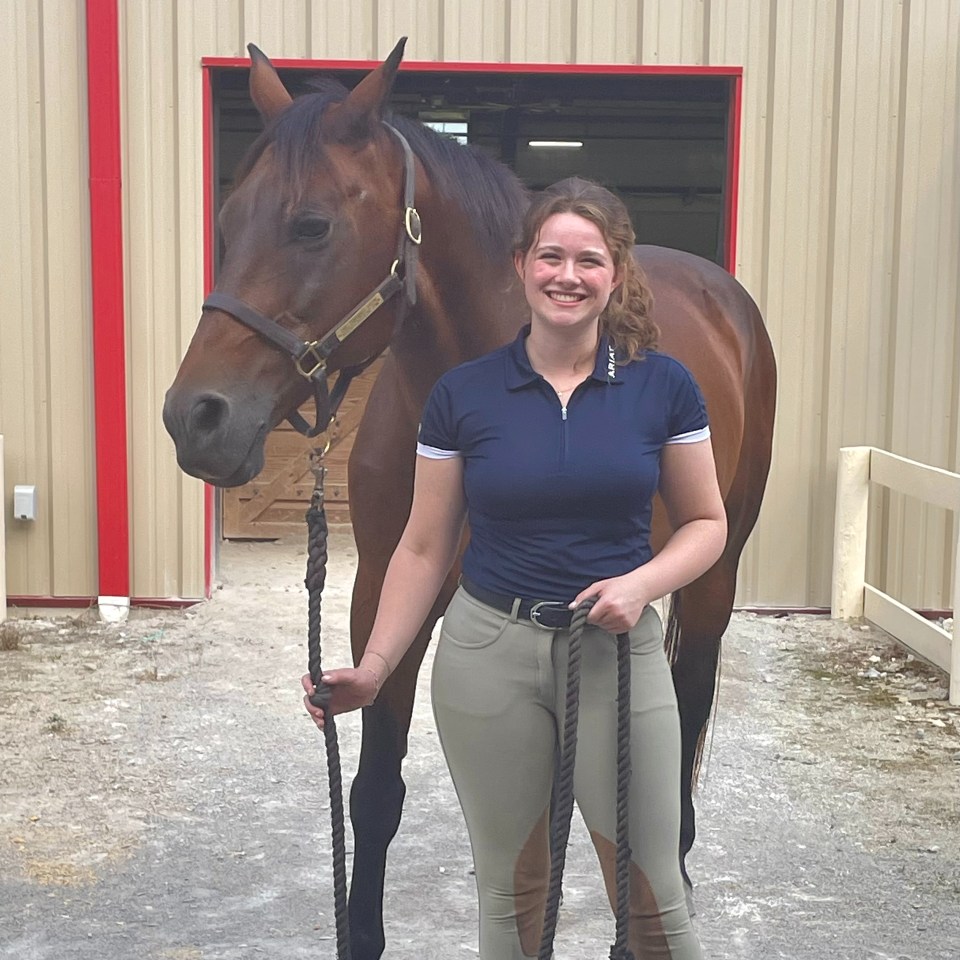 Reilly Moroney posed with her horse outside