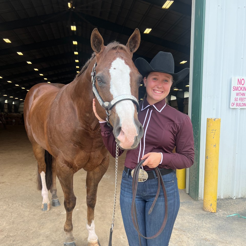 Serrin Whitt leading her horse out of the arena