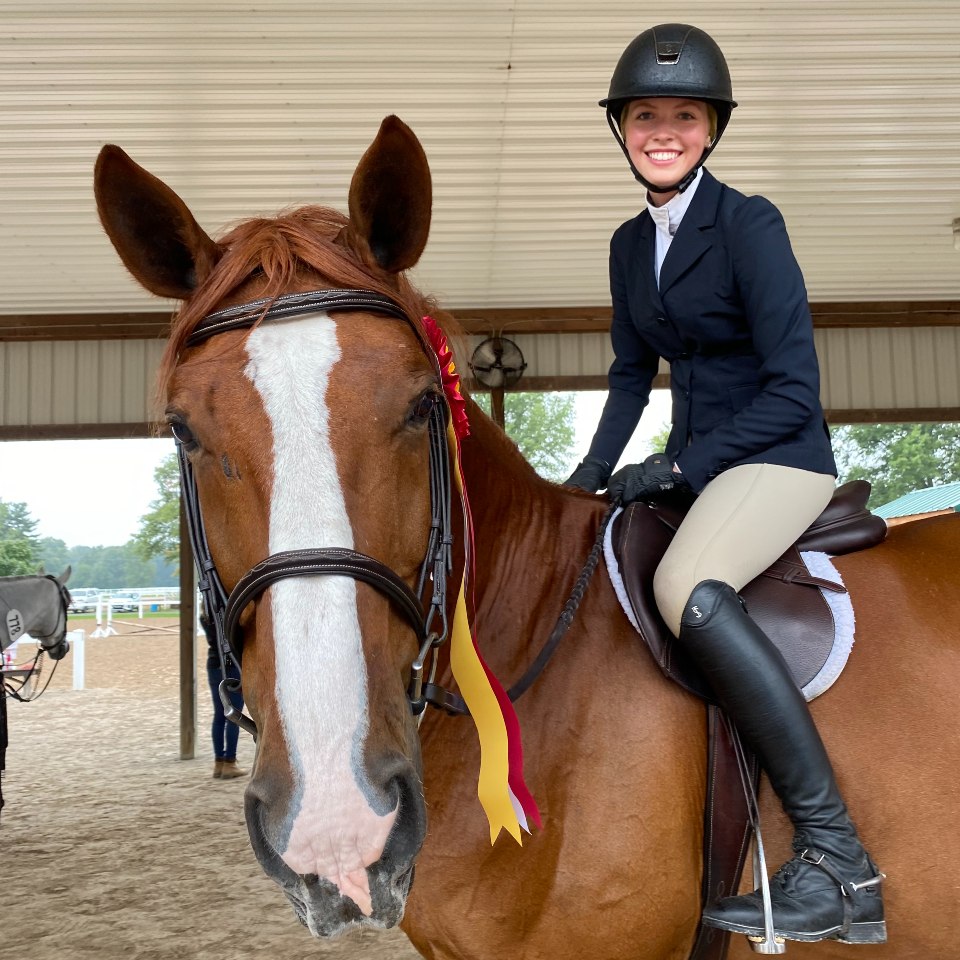 Sofie Olson riding a horse outside