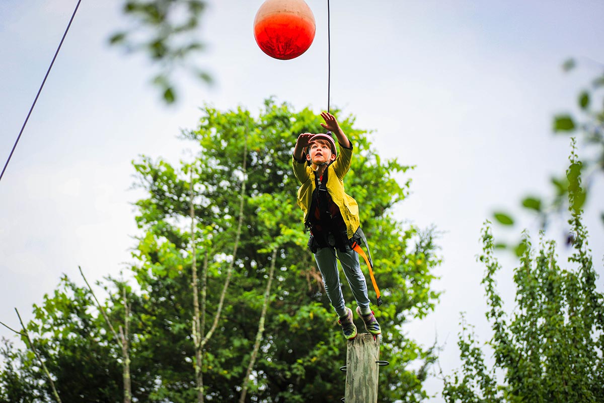 child participating in our aerial adventure course