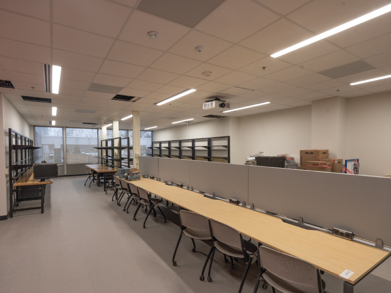 Classroom in the Advanced Manufacturing Workforce and Innovation Hub with tables and chairs.
