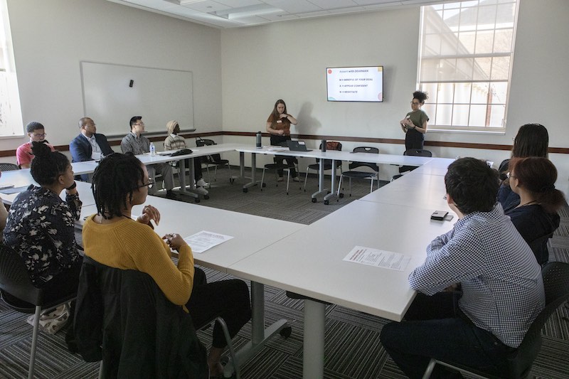 Room 1080 with students listening to a presentation