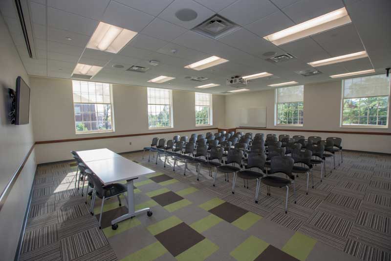 ASC 1086, a spacious room filled with neatly arranged chairs and tables.