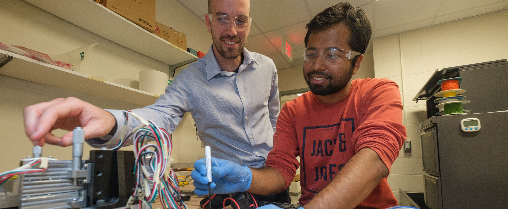 Faculty member assisting a student.