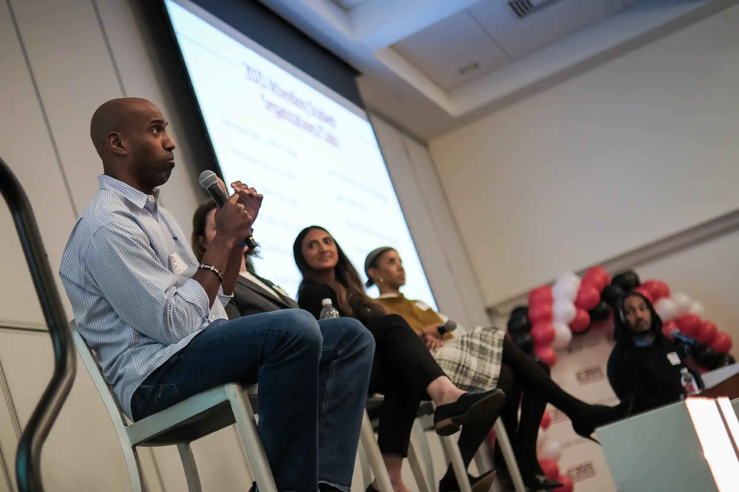 Diverse Miami Alums speaking with students