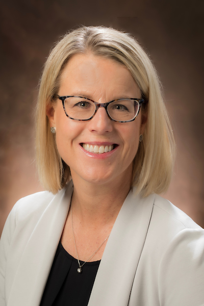 A headshot photo of Jenni Szolwinski.