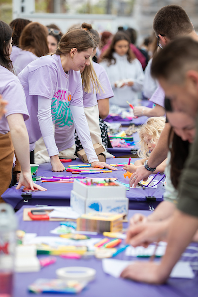 Students working and painting at a table