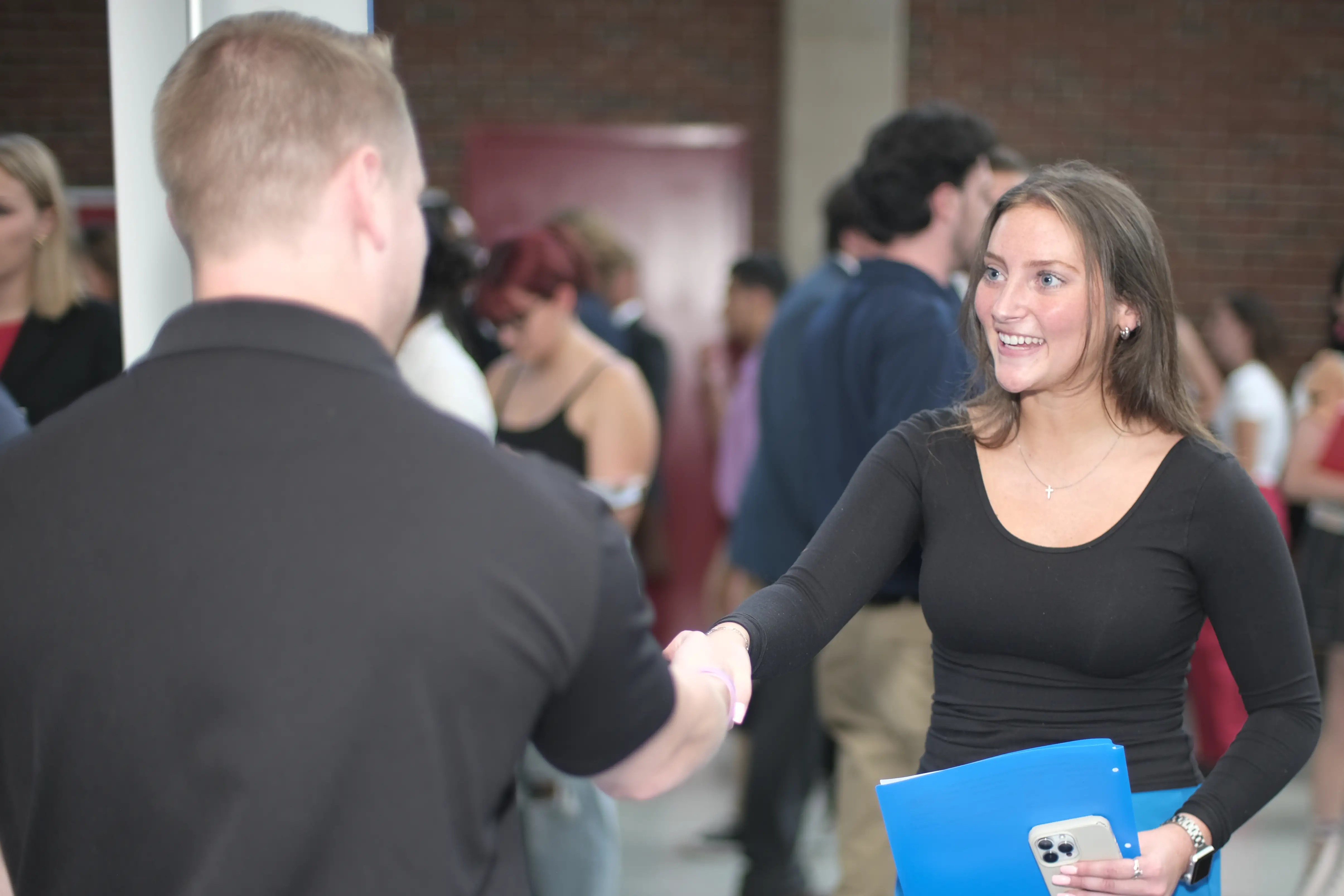 Miami student speaking with an employer at Career Fair