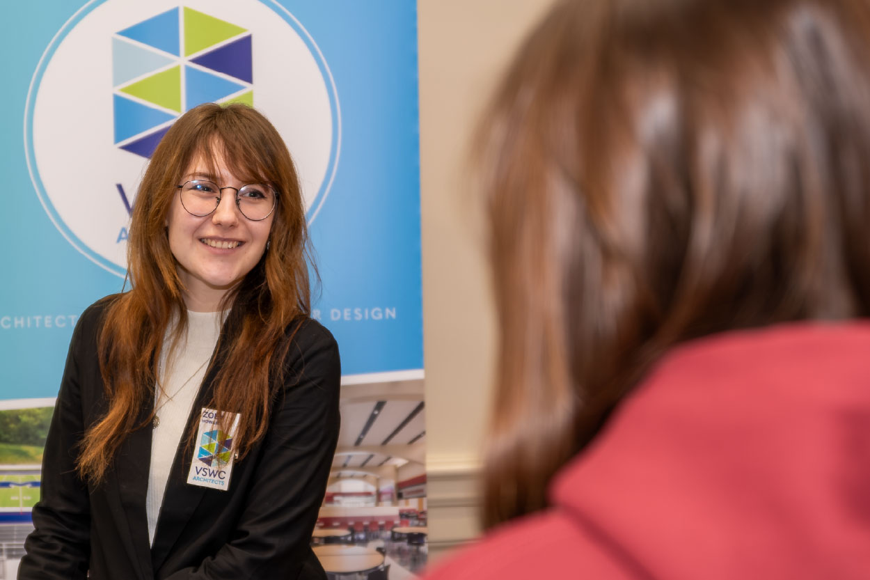 Employer networking with Miami students at the Architecture + Design Career and Internship Fair
