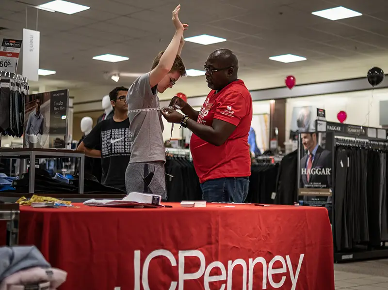 Miami student getting sized for a suit at the Suit-Up Event