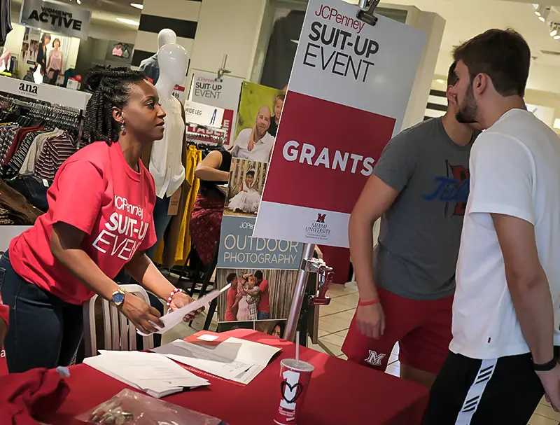 Students picking up funding for professional apparel at the Suit-Up Event