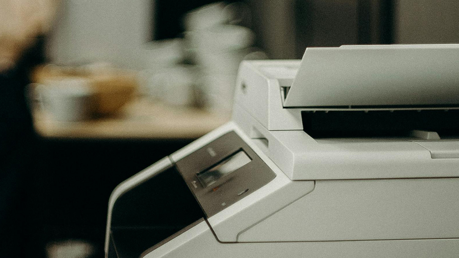 A printer with printed pages coming out.