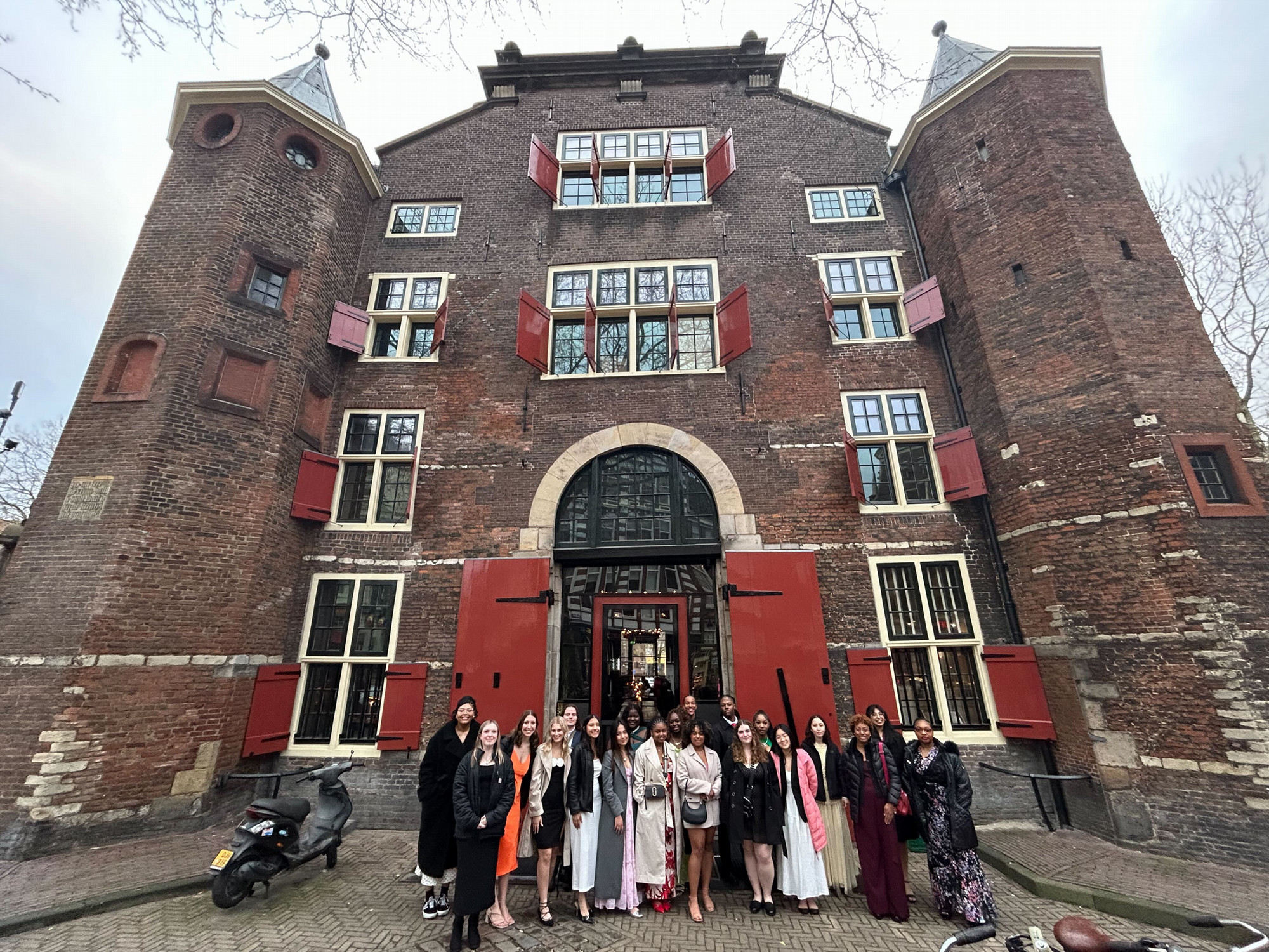 Career Academy participants pose in front of a medieval building during their tour of Europe.