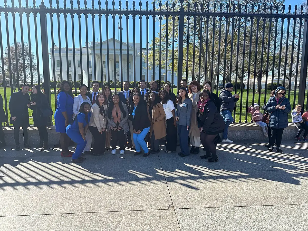 Career Academy participants pose for a photo in front of the White House.