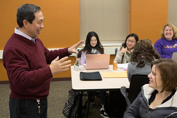 faculty teaching at front of classroom