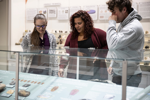 Claire McLeod with students in the geology museum 
