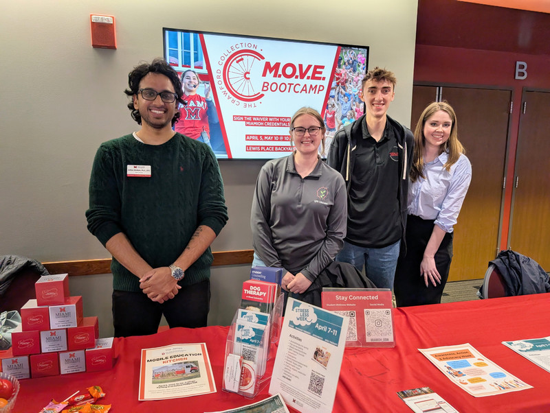 Students at the Student Counseling Service table at Stress Less Day.