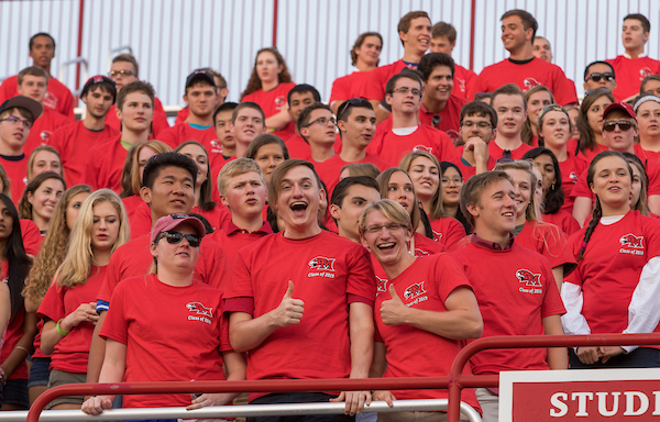 Students in the student section at a Miami football game.