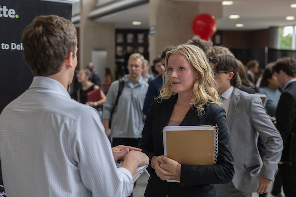 A student speaks to an employer at a Career Fair.