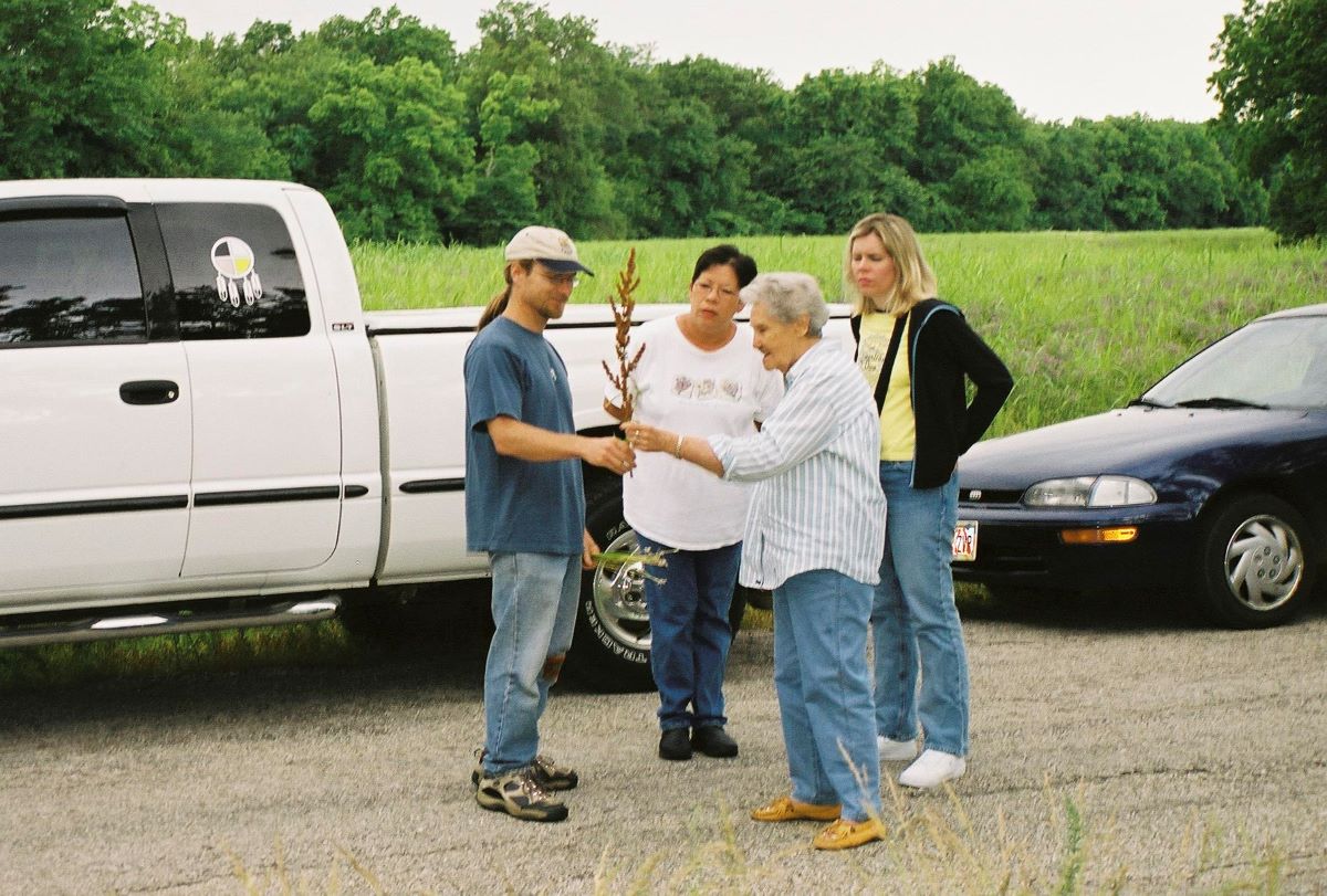 Michael Gonella with Elder Mildred Walker and Sherrie Sutterfield in Oklahoma examining some harvested plants.