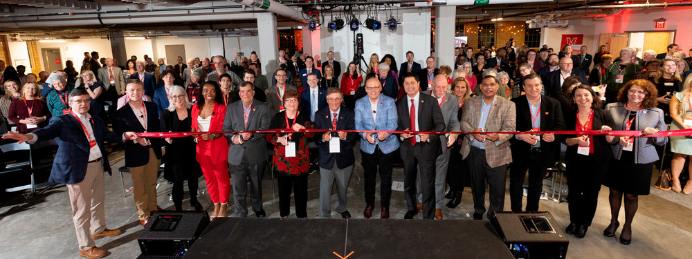 the College@Elm team cutting the ribbon on opening day