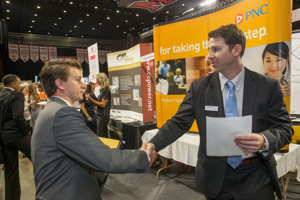 Student shaking PNC representative's hand at 2015 Fall Career Fair