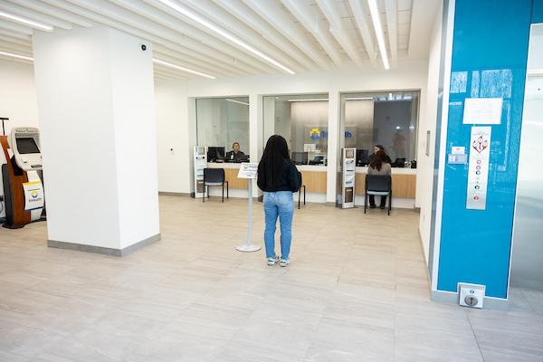 Patient waiting to register at the clinic.