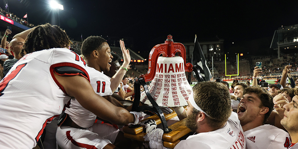 football team reclaiming the bell from university of cincinnati