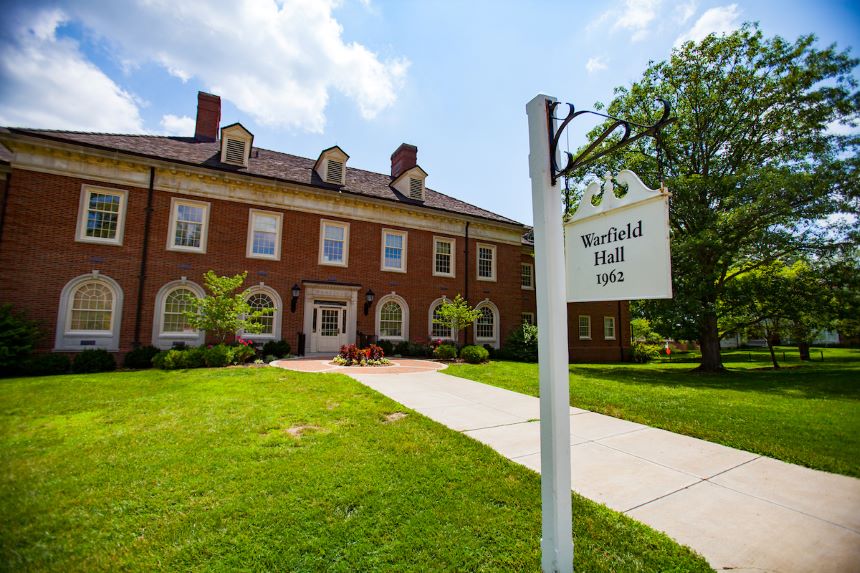 The red brick entrance of Warfield Hall where the Office of Community Standards can be found