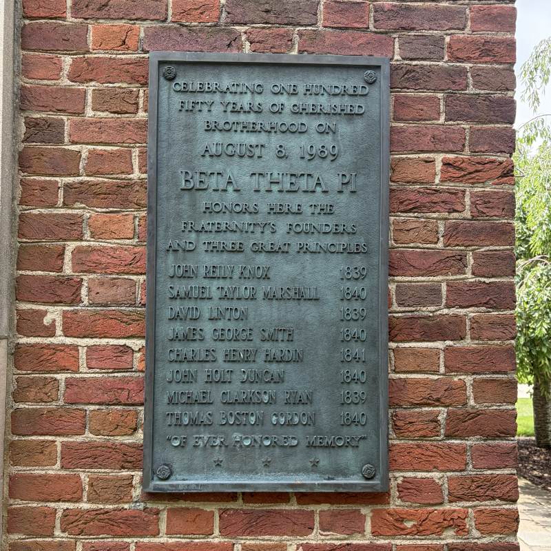 Plaque that reads Celebrating one hundred fifty years of cherished brotherhood on August 8, 1989, Beta Theta Pi honors here the fraternity’s founders and three great principles – John Reily Knox 1839, Samuel Taylor Marshall 1840, David Linton 1839, James George Smith 1840, Charles Henry Hardin 1841, John Holt Duncan 1840, Michael Clarkson Ryan 1839, Thomas Boston Gordon 1840. 'Of Ever Honored Memory'.