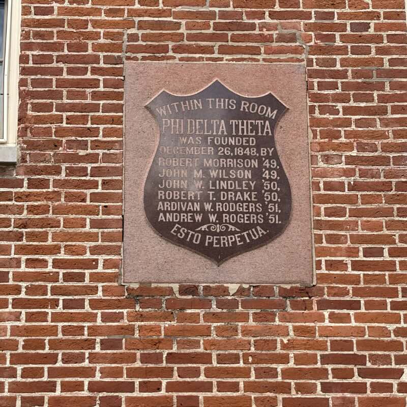 Closeup of Elliott Hall Plaque. Reads within this room Phi Delta Theta was founded December 28, 1848 By Robert Morrison ’49, John M. Wilson ’49, John W Lindley ’50, Robert T Drake ’50, Ardivan W Rodgers and Andrew W. Rogers. Estu Perpetua.