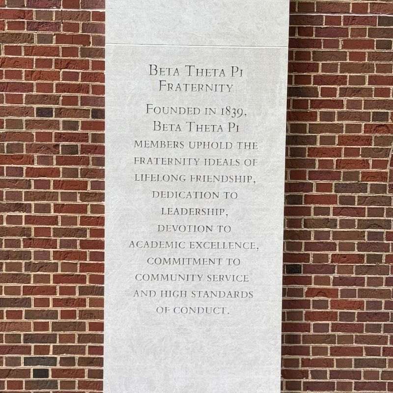 Concrete column with words etched: Beta Theta Pi Fraternity. Founded in 1839, Beta Theta Pi members uphold the fraternity ideals of lifelong friendship, dedication to leadership, devotion to academic excellence, commitment to community service, and high standards of conduct. 