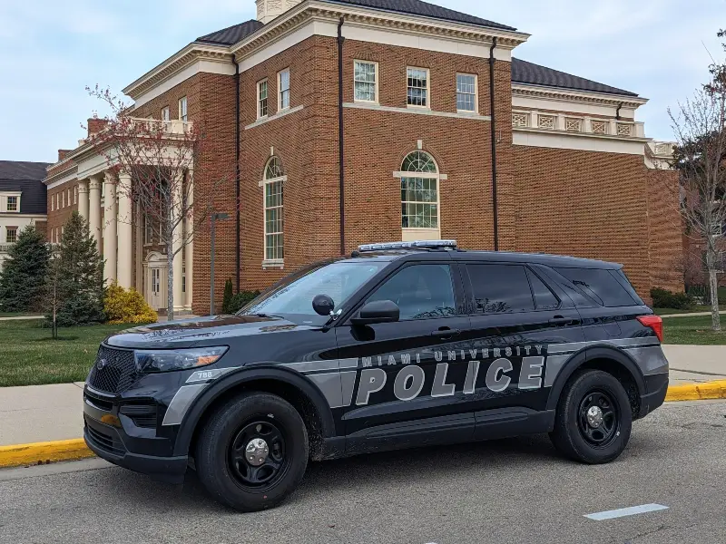 police vehicles parked in front of police department 