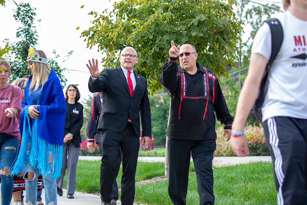 President Crawford and Chief Douglas Lankford walking together in Day of Remembrance procession