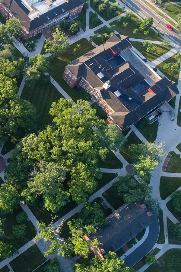 Campus building at Miami University with spring flowers in the foreground.