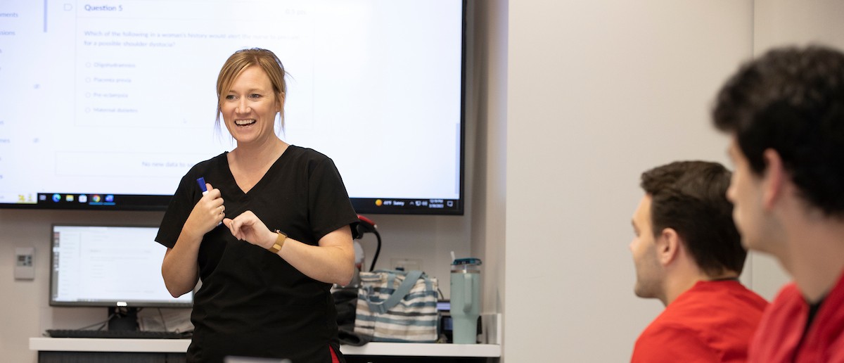 Doctor of Nursing Practice student during a classroom presentation.