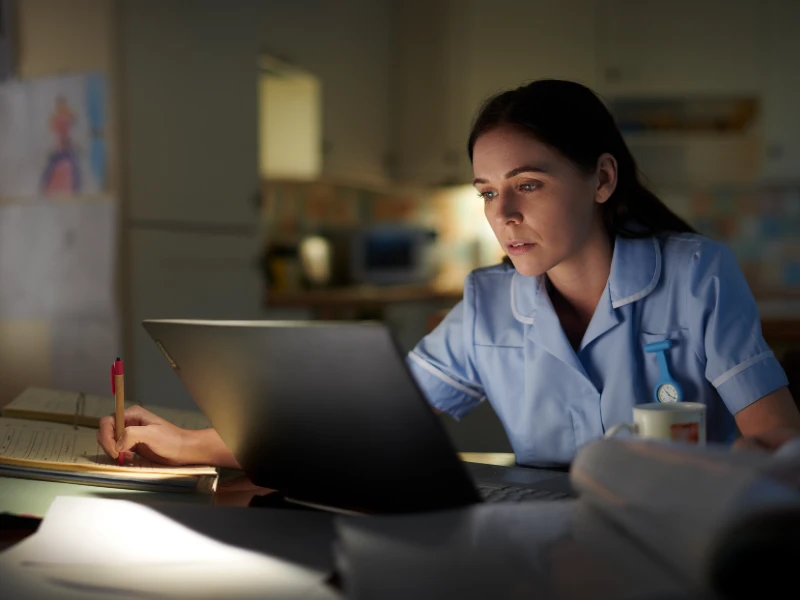 A nursing student working at computer. 